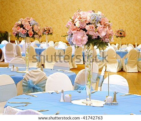  photo Elegant reception hall set with flowers for a beautiful wedding