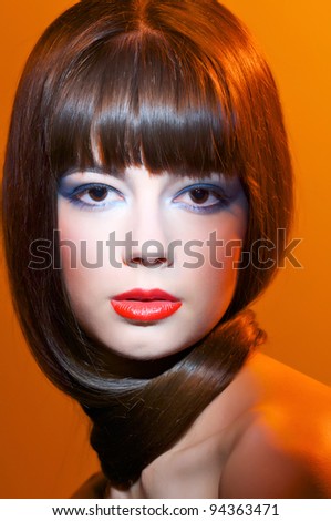 European fashion model with bright make up yellow red background