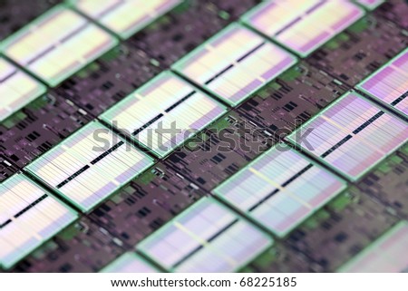 Macro shot of a computer chip on a silicon wafer