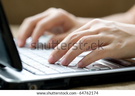 stock photo : Human hands typing labtop.