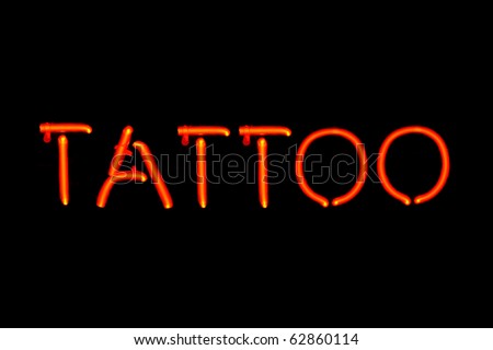 neon tattoo signs. stock photo : Red neon sign of