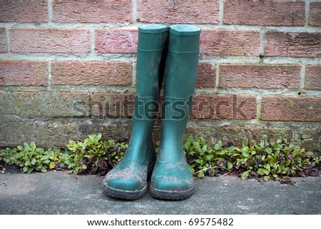 Green wellington boots.
