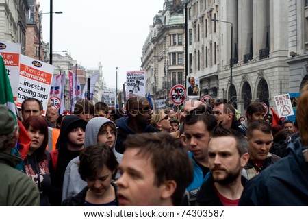 PICCADILLY, LONDON - MARCH 26: Demonstrators march along Piccadilly during protests against public sector funding cuts in central London on 26th March 2011.