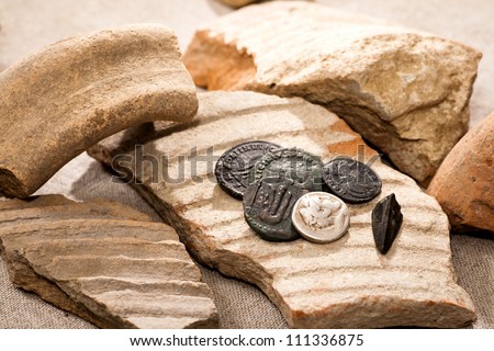 Ancient coins and broken earthenware