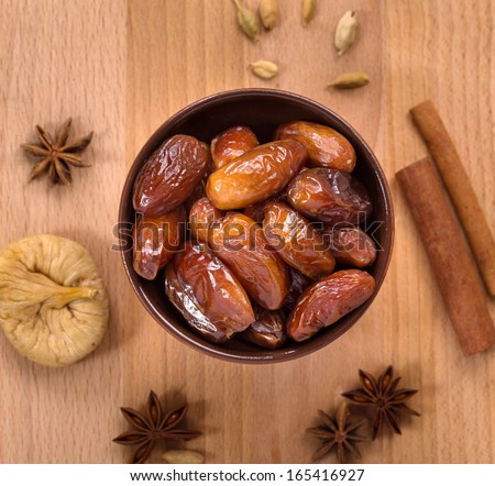 Fresh dry dates in a  bowl top view