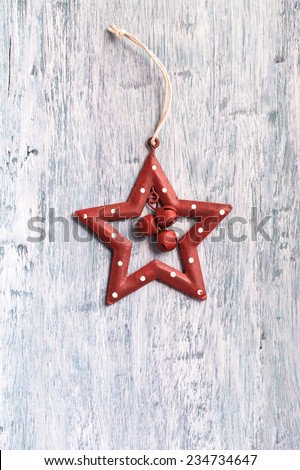 Vintage Christmas red star decoration on light blue painted wood