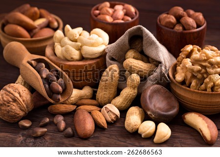 Different types of nuts: walnut, hazelnut, cashew, peanuts; brazil nuts, pine nuts and other