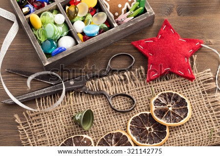 Hand crafted holiday ornaments and vintage scissors top view