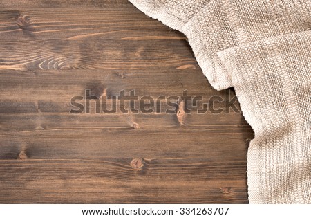 Gray handmade tablecloth from right side wooden table top view. Food background