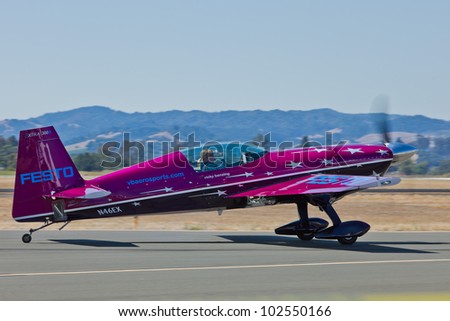 SANTA ROSA, CA - AUG 20: Vicky Benzing taxi in her purple Extra 300S after demonstration of high performance aerobatics during the Wings Over Wine Country Air Show, on August 20, 2011, Santa Rosa, CA.