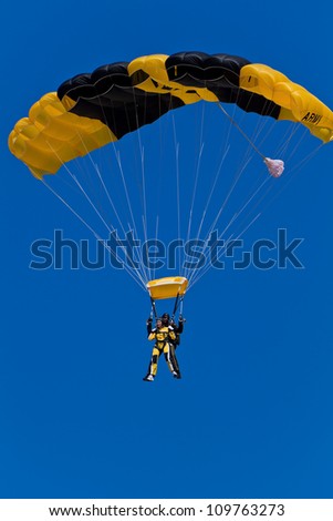HILLSBORO, OR - AUG 4: Tandem skydiving with a member of the US Army Golden Knights Parachute Team at the Oregon Air Show at Hillsboro Airport on August 4, 2012 in Hillsboro, OR.