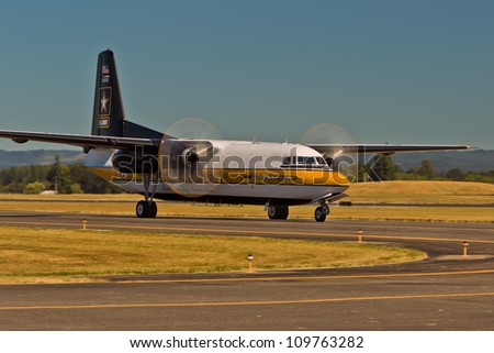 HILLSBORO, OR - AUG 4: The C-31A Troopship of the US Army Golden Knights Parachute Team taxi at the Oregon Air Show at Hillsboro Airport on August 4, 2012 in Hillsboro, OR.