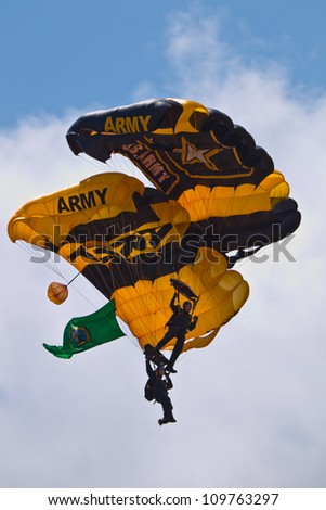 TACOMA, WA - JULY 21: The US Army Golden Knights Parachute Team demonstrate tandem parachuting during Air Expo at McChord Field Joint Base Lewis-McChord on July 21, 2012 in Tacoma, WA.