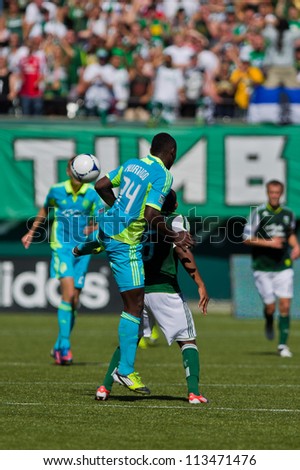 PORTLAND, OR - SEPT 15: The Seattle Sounders Jhon K. Hurtado #34 jumps for the ball against the Portland Timbers Darlington Nagbe #6 during the game, on Sep 15, 2012 at Jeld-Wen Field in Portland, OR