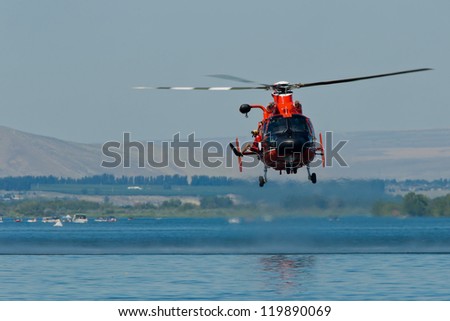 TRI-CITIES, WA - JULY 29: USCG Eurocopter HH-65C Dolphin Helicopter Rescue Demonstration Flight at the Lamb Weston Columbia Cup July 29, 2012 on the Columbia River in Tri-Cities, WA.