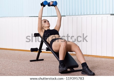 woman training for muscle of chest on incline bench