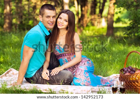 couple at outdoor picnic in forest park
