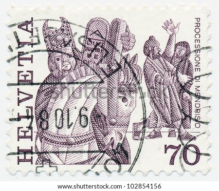 SWITZERLAND - CIRCA 1977: A stamp printed in the Switzerland shows Procession (horse and masked men), Mendrisio, series Folk Customs, circa 1977