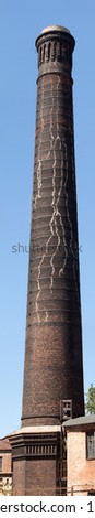 The old brick pipe reinforced with iron rings