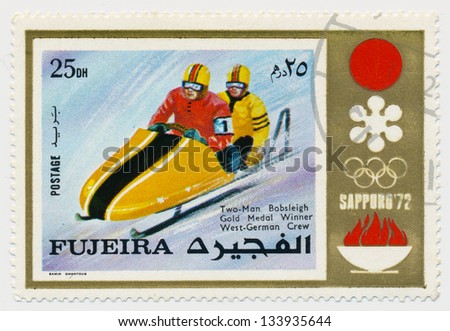 UNITED ARAB EMIRATES - CIRCA 1972: A stamp printed in Fujeira, shows Two-man Bobsleigh, Gold Medal Winner, West-German Crew, circa 1972