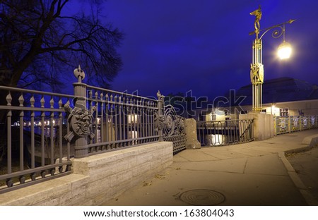 Night view of the lantern Pantaleon Bridge and the southern fence of the Summer Garden in St. Petersburg, Russia