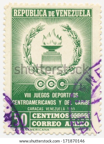 VENEZUELA - CIRCA 1958: A stamp printed in Venezuela shows Fire with laurel wreath emblem, circa 1958