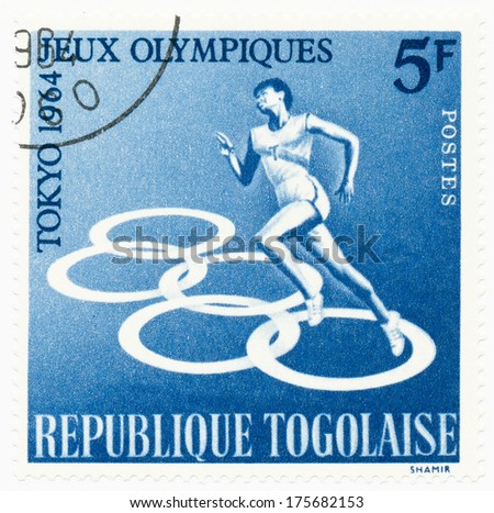 TOGO - CIRCA 1964: A stamp printed in Togo shows runner, series Olympic games in Tokyo, circa 1964