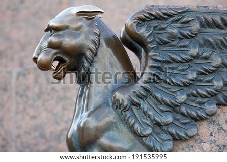 Bronze sculpture of Griffin on the University Embankment of the Neva River in St. Petersburg