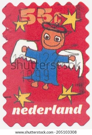 NETHERLANDS - CIRCA 1999: A stamp printed in Netherlands shows Angel a child\'s drawing on the theme of Christmas, circa 1999