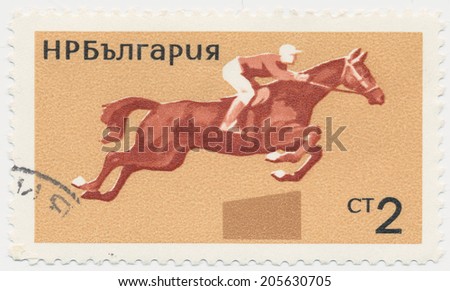 BULGARIA - CIRCA 1965: A stamp printed in Bulgaria shows horse jumping and Jockey, circa1965