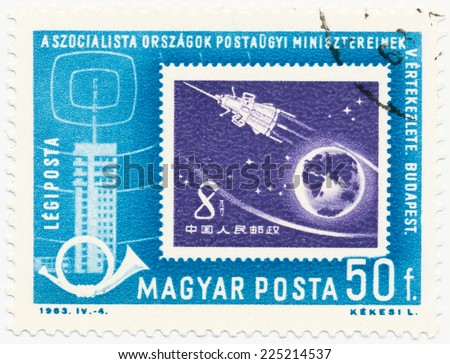 HUNGARY - CIRCA 1963: A stamp printed in Hungary shows Chinese mark in 1959 with the image of a spaceship, circa 1963