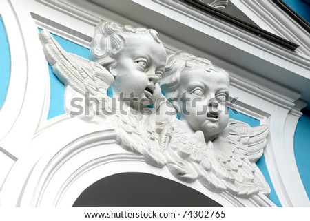 Faces of Angels. Ornament fragment  Smolny cathedral in the Sankt-Petersburg, Russia