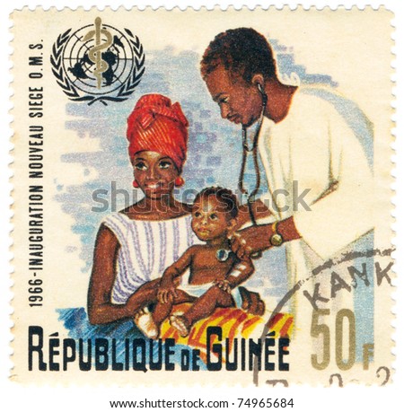 REPUBLIC OF GUINEA - CIRCA 1966: A stamp dedicated World Health Organization shows doctor, mother and child, title \