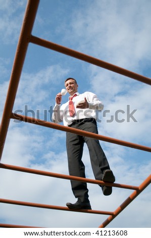 man walks up the stairs with a cup