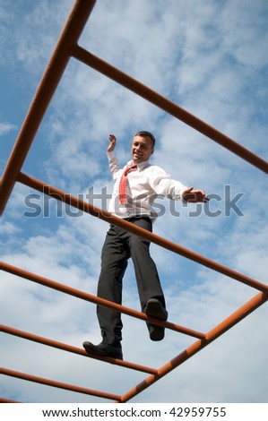 businessman going up the stairs to the sky