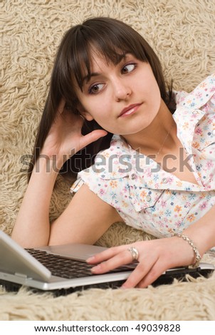 beautiful young girl with a laptop on a white background