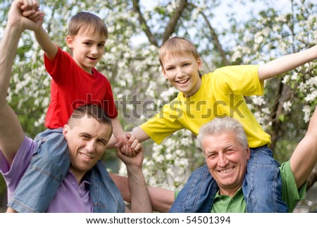 happy family playing in a summer park