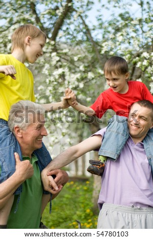 happy family playing in a summer park