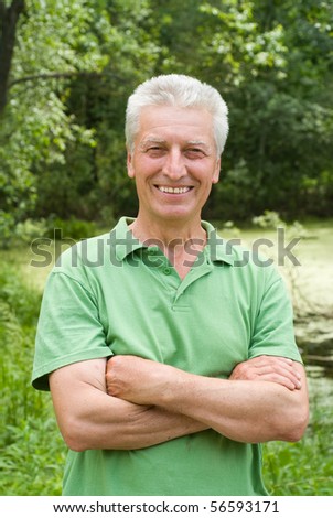happy elderly man in a summer park