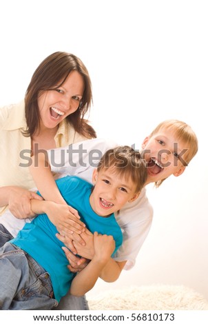 happy mom with two children on a white background