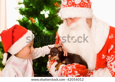 Santa gives presents to child on a white background
