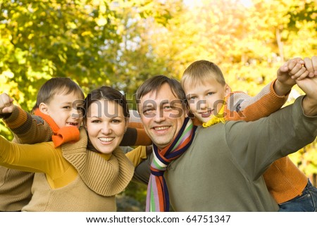 happy family of four on the nature
