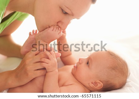 baby with her mother on the white background