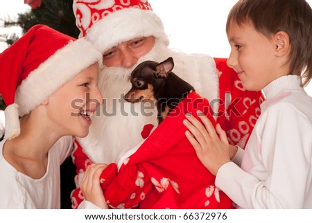 Santa gives presents to children on a white background