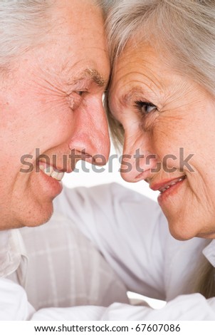 senior happy couple on a white background