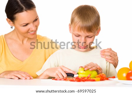 beautiful mom and son prepares breakfast vegetable