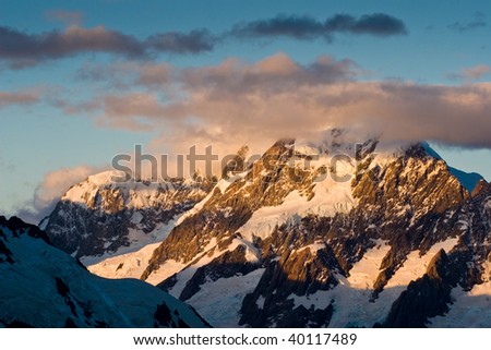 Mt Aoraki, the highest mountain in New Zealand, a magnificent rugged mountain with snow and ice, at sunset.