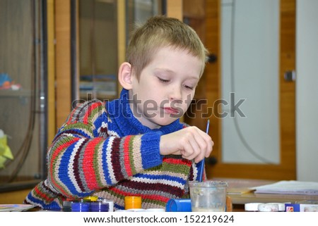 The boy at a drawing lesson