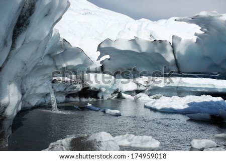 Glacial melt creating waterfall on the Matanuska Glacier, Alaska USA