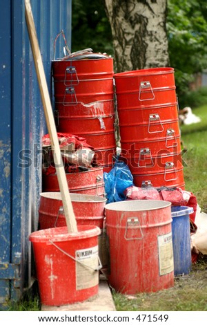 Red buckets of industrial painting